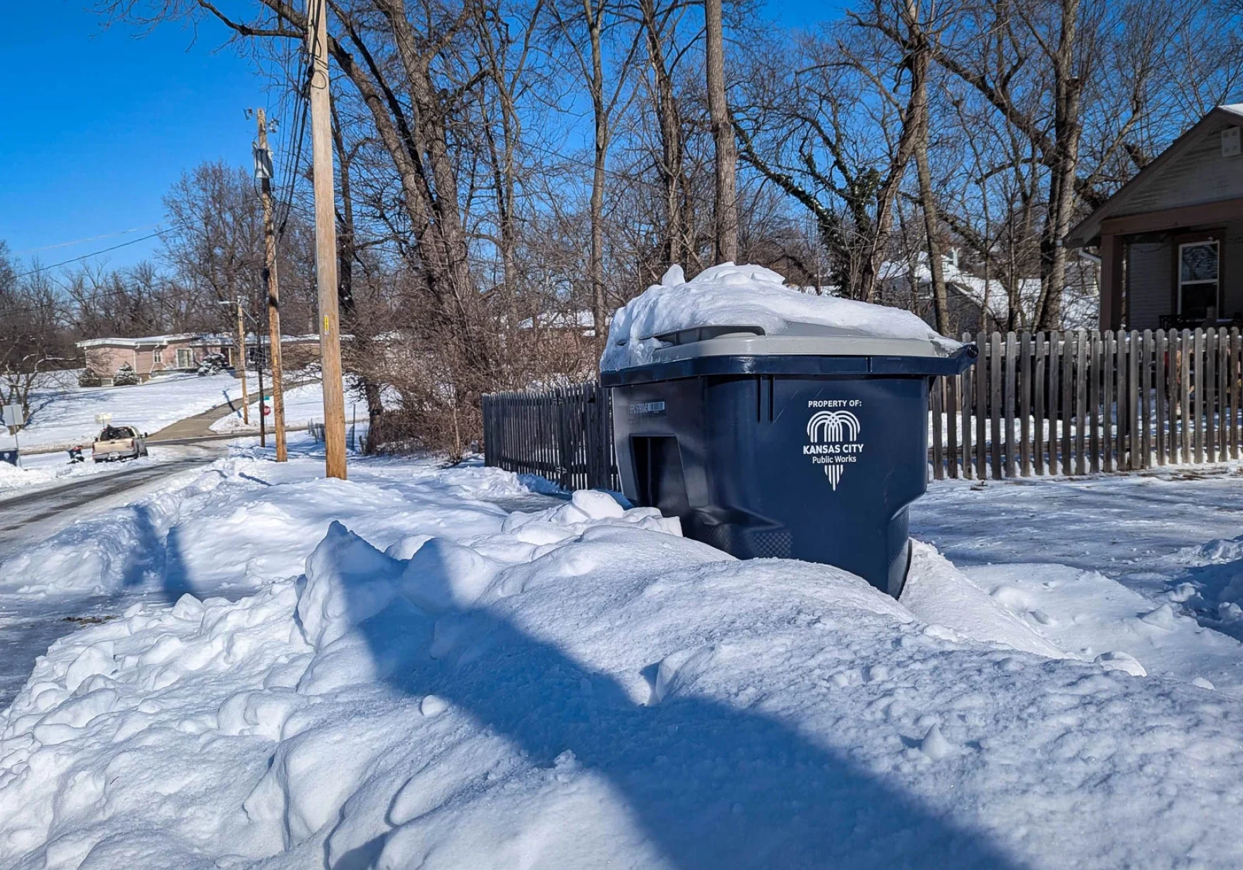 Trash pickup is, well, picking up around the region up after delays caused by recent snow storms. (Luke X. Martin | KCUR 89.3)