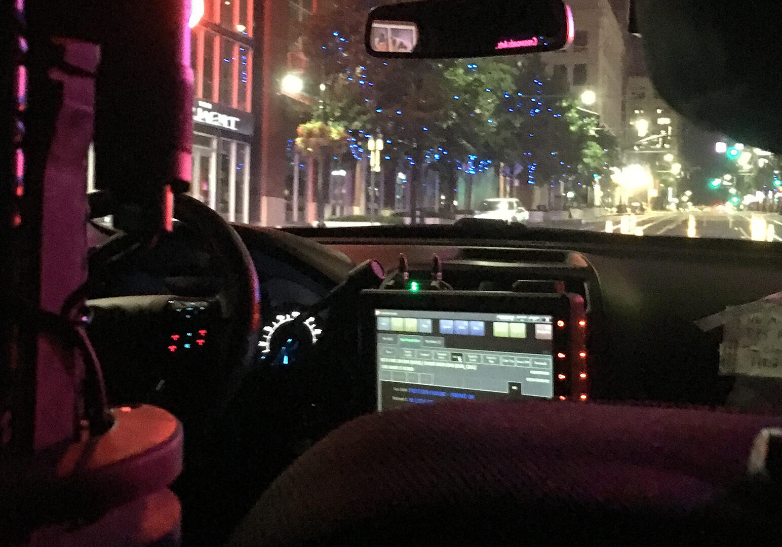 inside of police car on patrol