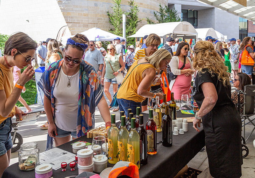 People tasting wine at the Lenexa Art Fair.