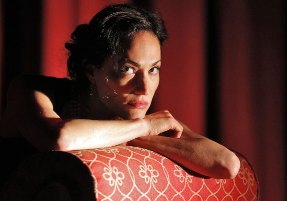 A brooding woman on a couch