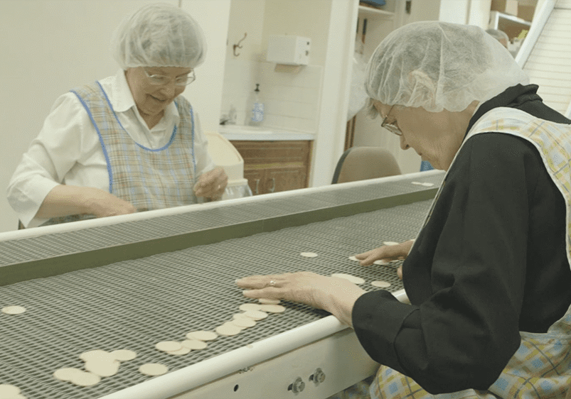 sisters perform quality control on the altar bread