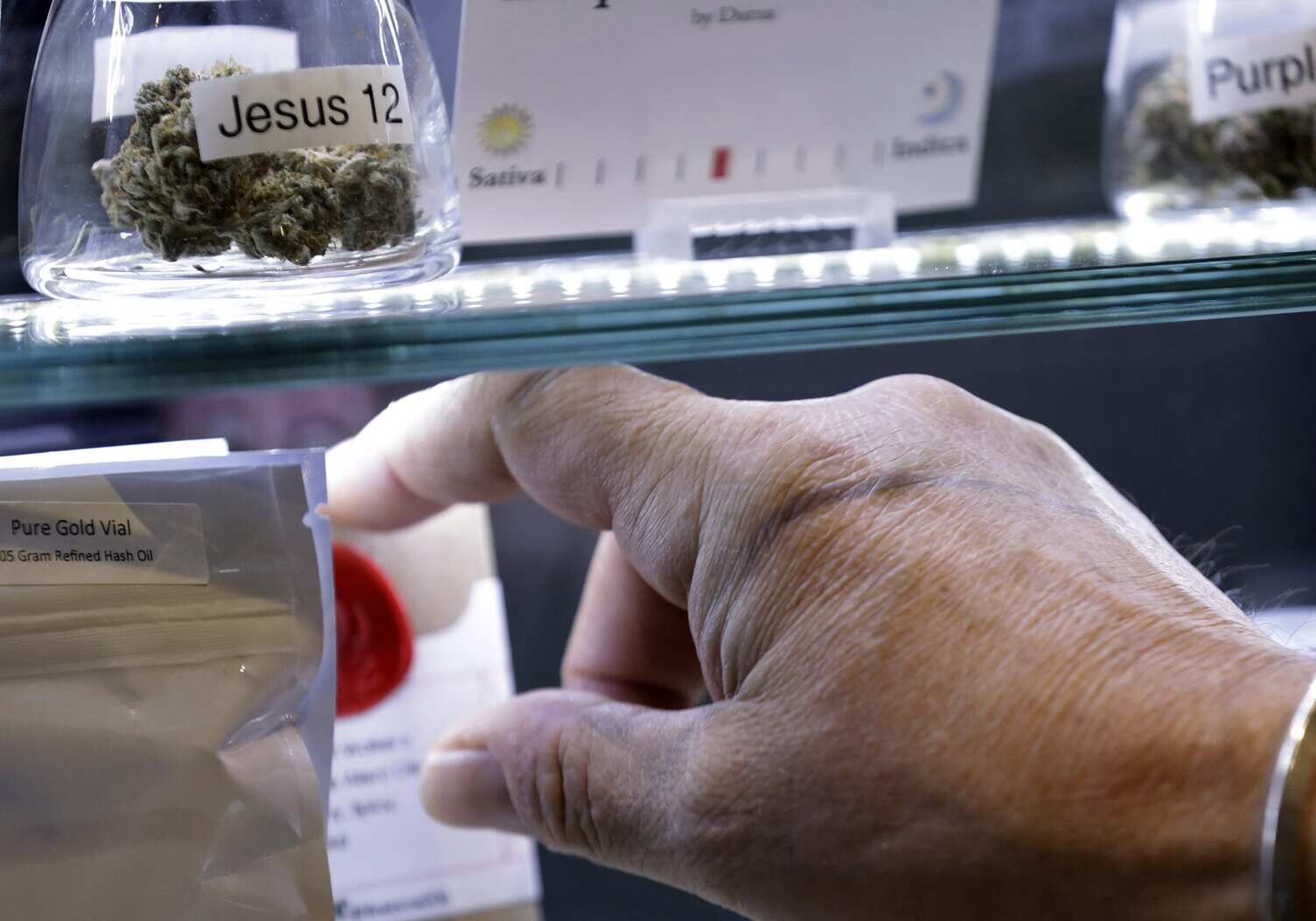 Northwest Patient Resource Center co-owner Jake Dimmock reaches for a medical marijuana dispensary product in the shop Tuesday, Jan. 6, 2015, in Seattle. A leading Republican lawmaker has a novel proposal for reining in Washingtons uncontrolled medical marijuana industry: medical pot shops that dont sell what most people think of as pot. A bill being filed this week by Sen. Ann Rivers would create licenses for medical marijuana dispensaries and require product testing thats at least as strict as what the state requires in its recreational marijuana stores. But the medical stores could not sell dried bud, only edibles and marijuana concentrates, such as oil. The products would be sales-tax-free. (AP Photo/Elaine Thompson)