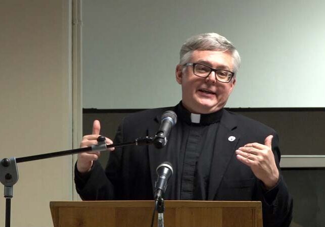 Monsignor Stuart W. Swetland, president of Donnelly College, Archdiocese of Kansas City in Kansas explains the Pope's climate change encyclical 'Laudato Sí.' (Photo: Steve Mencher | Flatland)