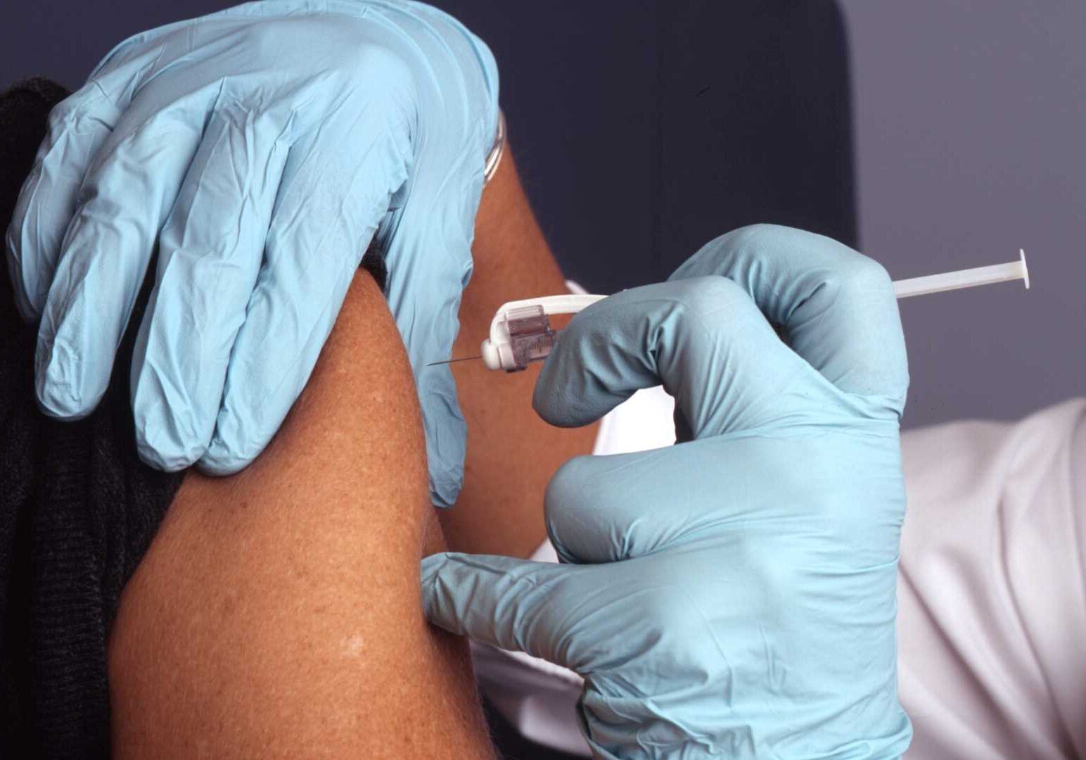 Person receiving an injection.