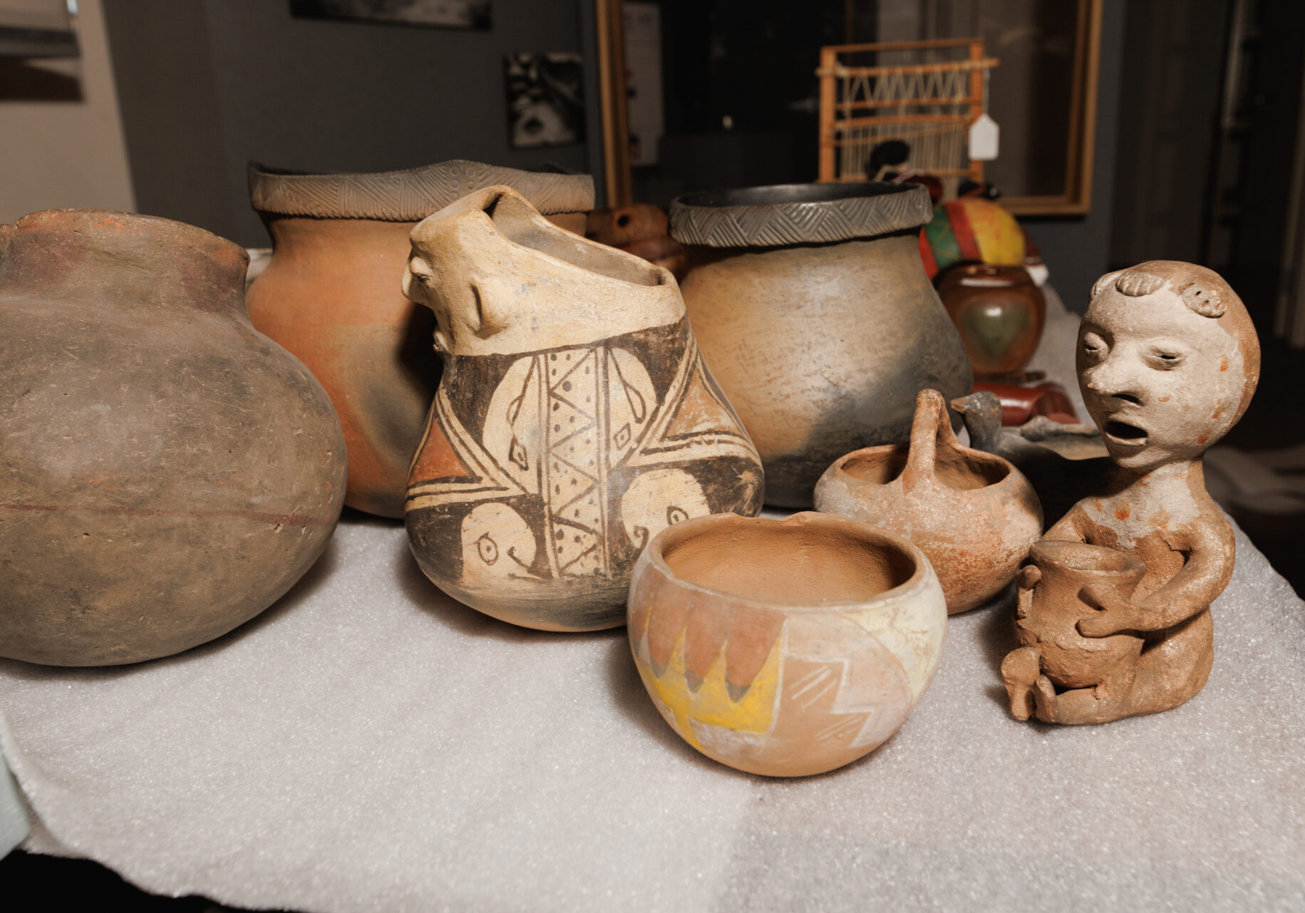 Native American pottery and artifacts fill a table at the Wyandotte County Historical Museum on March 26, 2025 in Bonner Springs, Kansas. (Chase Castor | Flatland)