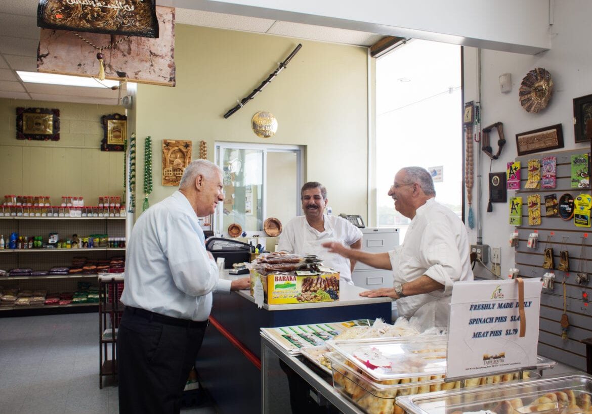 People in a butcher shop