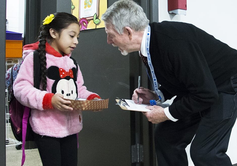 paul preston greeting a student