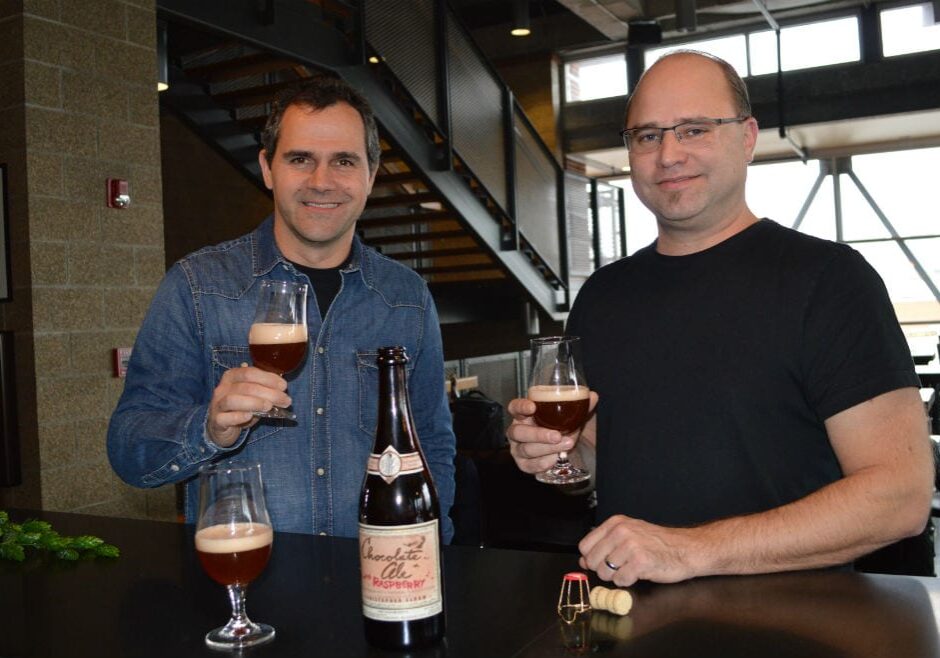 Boulevard brewmaster Steven Pauwels and chocolatier Christopher Elbow toast their latest collaboration: Chocolate Ale with Raspberry. (Photo: Jonathan Bender | Flatland)