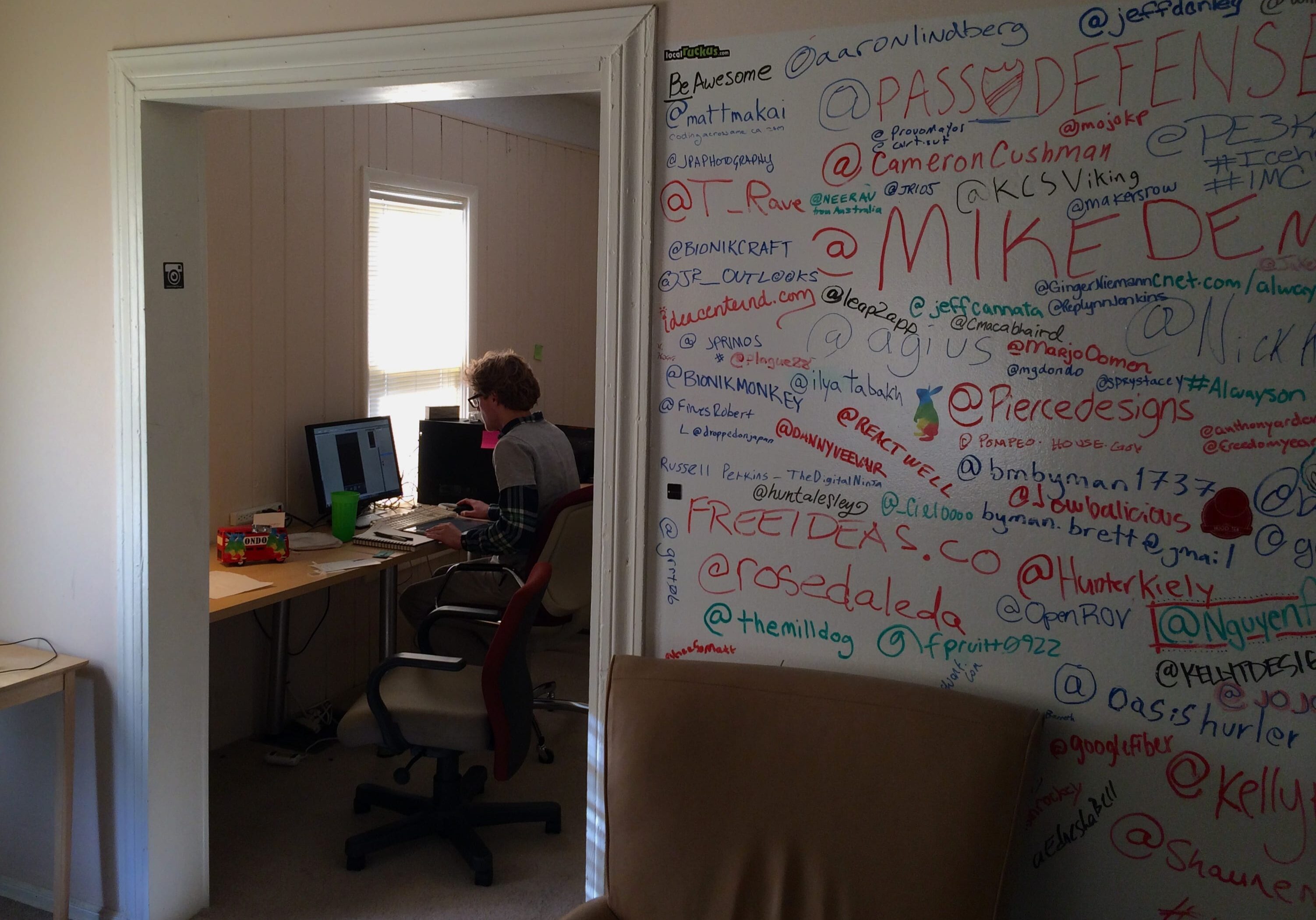 Kinsman working on his app design at the Homes for Hackers