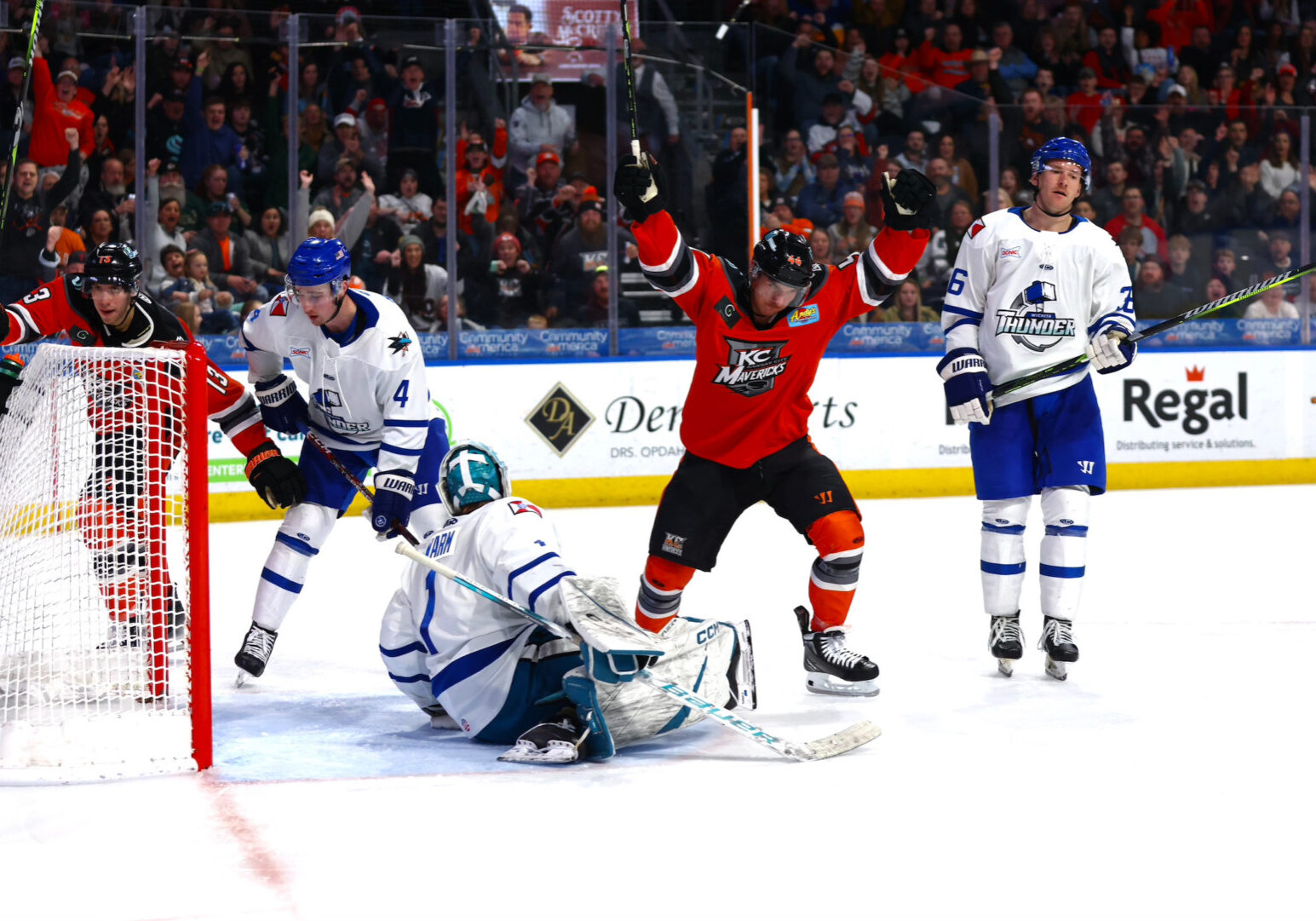 A KC Mavs hockey player takes a shot.