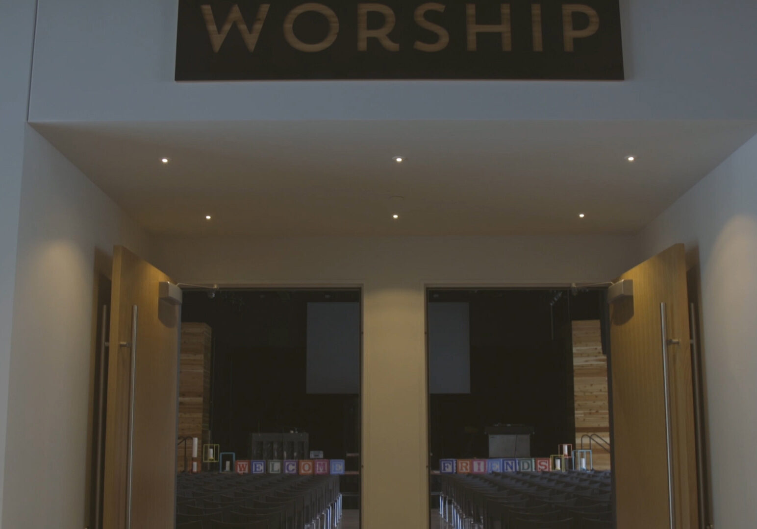 worship sign above sanctuary door