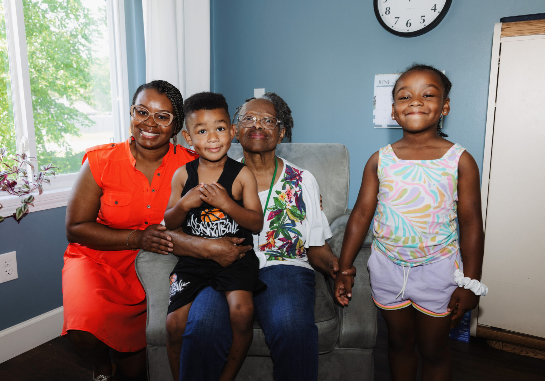 (L-R) Christina Hill and her grandmother, Lucy Wilkerson, pose for a photo with Christina’s kids, Hunter Hill Harris and Summer Hill Harris, at Lucy’s assisted living home in Grain Valley, Missouri. (Chase Castor | Flatland)