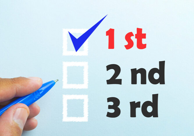 Ranking box graphic with hand writing over a blue background.