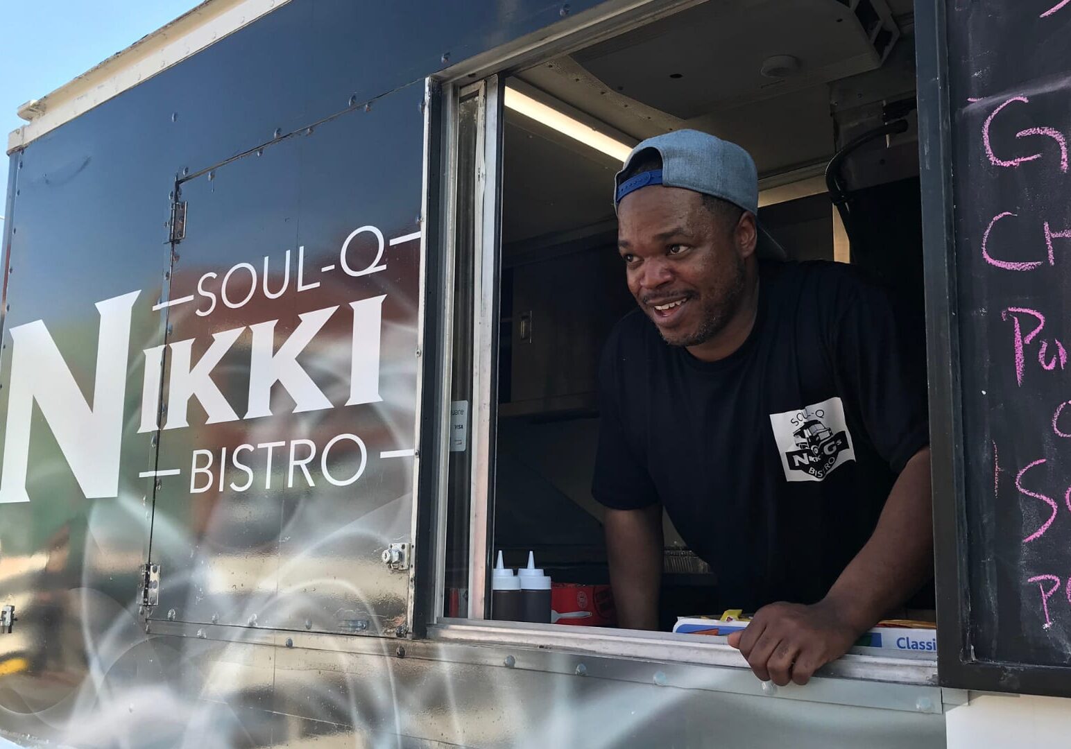 Nate Prim takes an order at Soul-Q Nikki Bistro