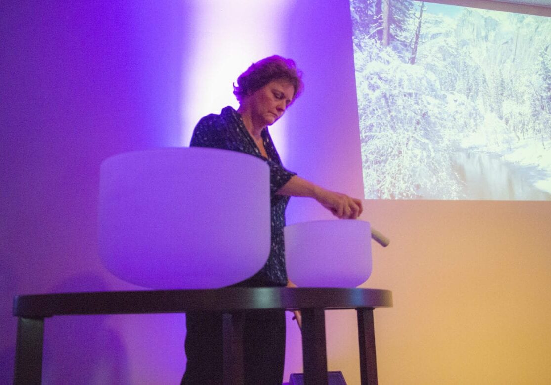 Sharon Divine plays crystal singing bowl