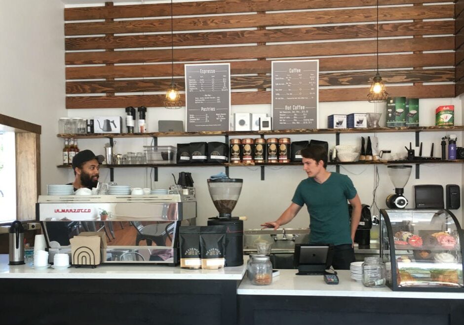 two baristas in a coffee shop