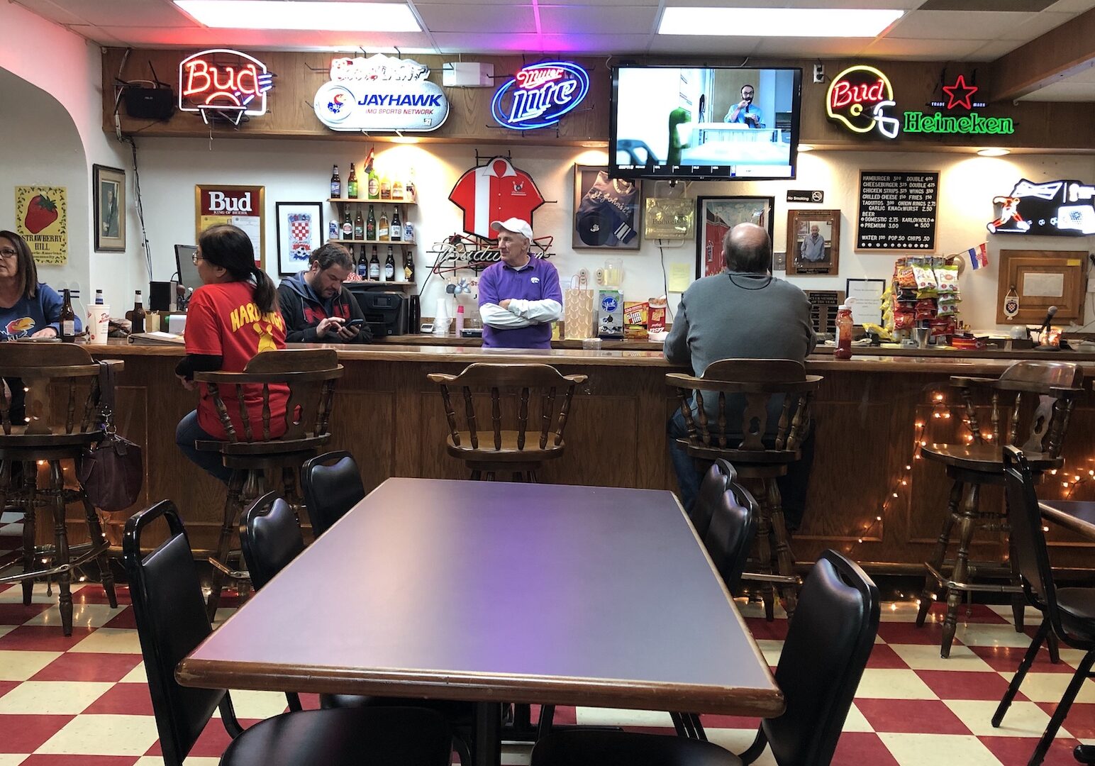 St. John's Catholic Club members hang out around the bar.