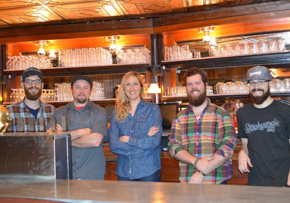 Brendan Gargano, Micah Weichart, Melissa VanGoethem, Greg Bland, and Ray Kerzner behind the bar at Stockyards Brewing Company. (Photo: Jonathan Bender | Flatland)