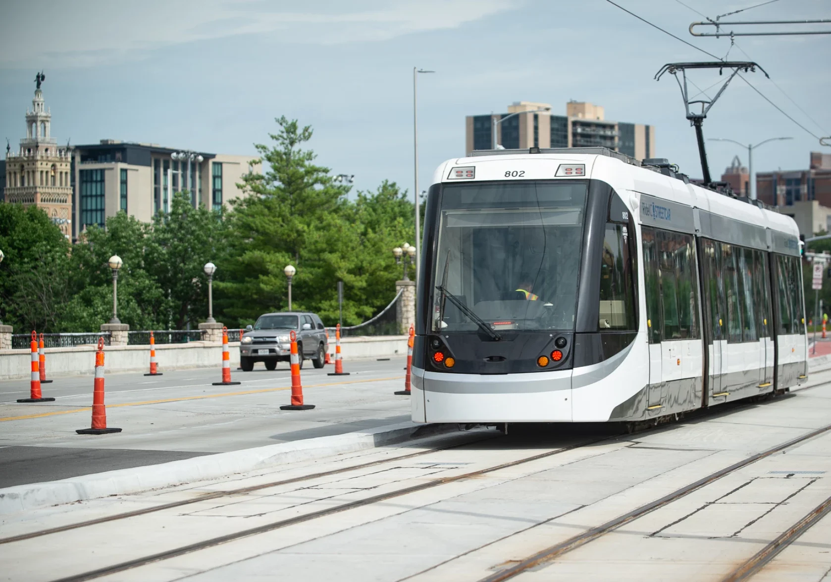 Streetcar 802 sits idle on Main Street near Country Club Plaza where it was undergoing testing on the Main Street extension on Thursday, July 24, 2025. (Carlos Moreno | KCUR 89.3)