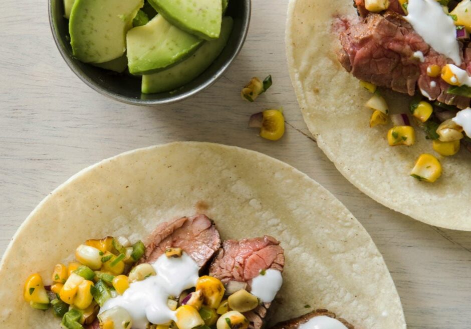 Flank steak tacos with charred corn salsa.