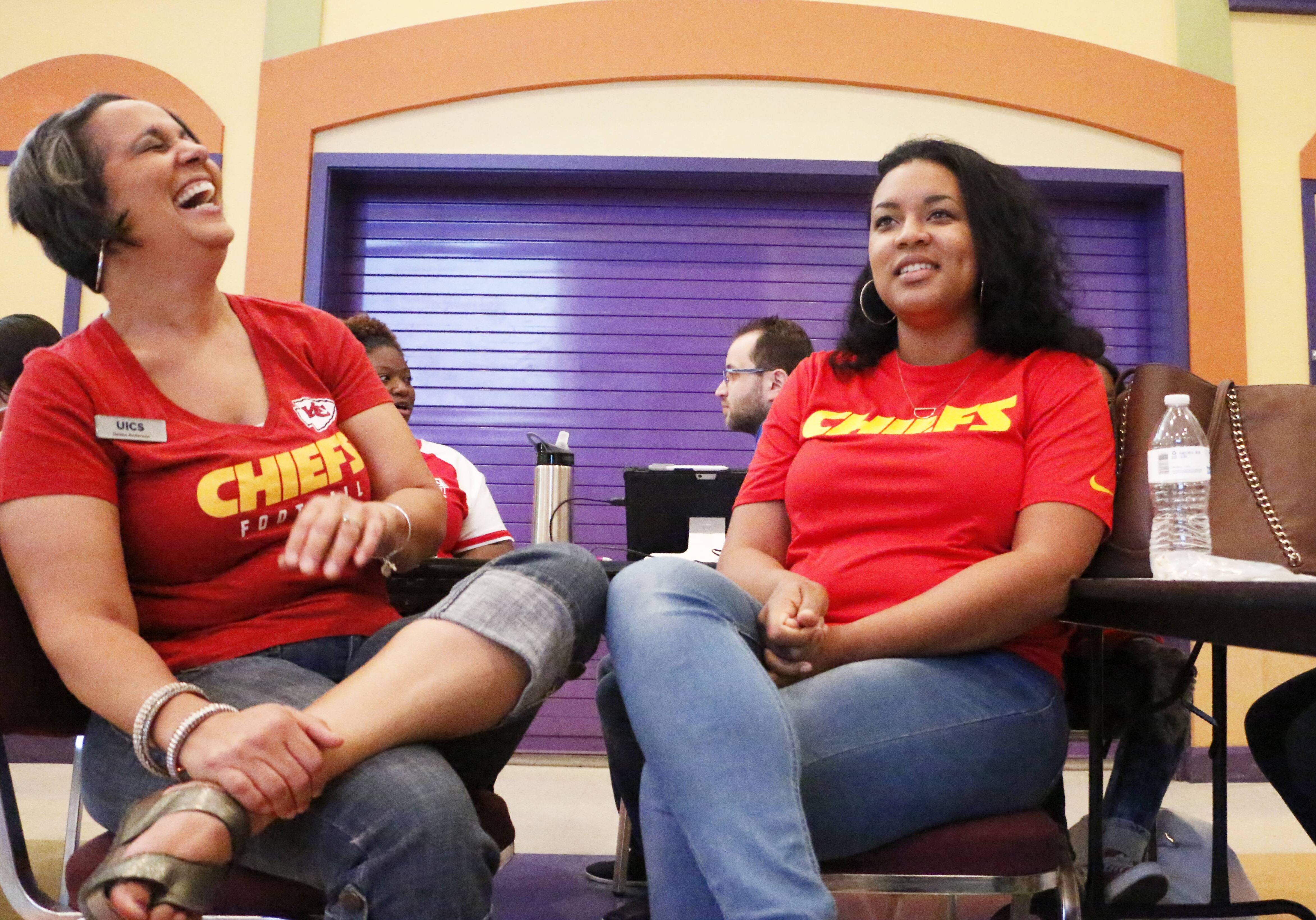 Deidre Anderson (left) shares a laugh with Matrika Hornsby during trauma-informed care training Friday at United Inner City Services, 2008 E. 12th St. in Kansas City. Anderson, executive director of the organization, and Hornsby, a lead teacher, were participating in training similar to that provided to educators in Lafayette County. (Mike Sherry | Flatland)
