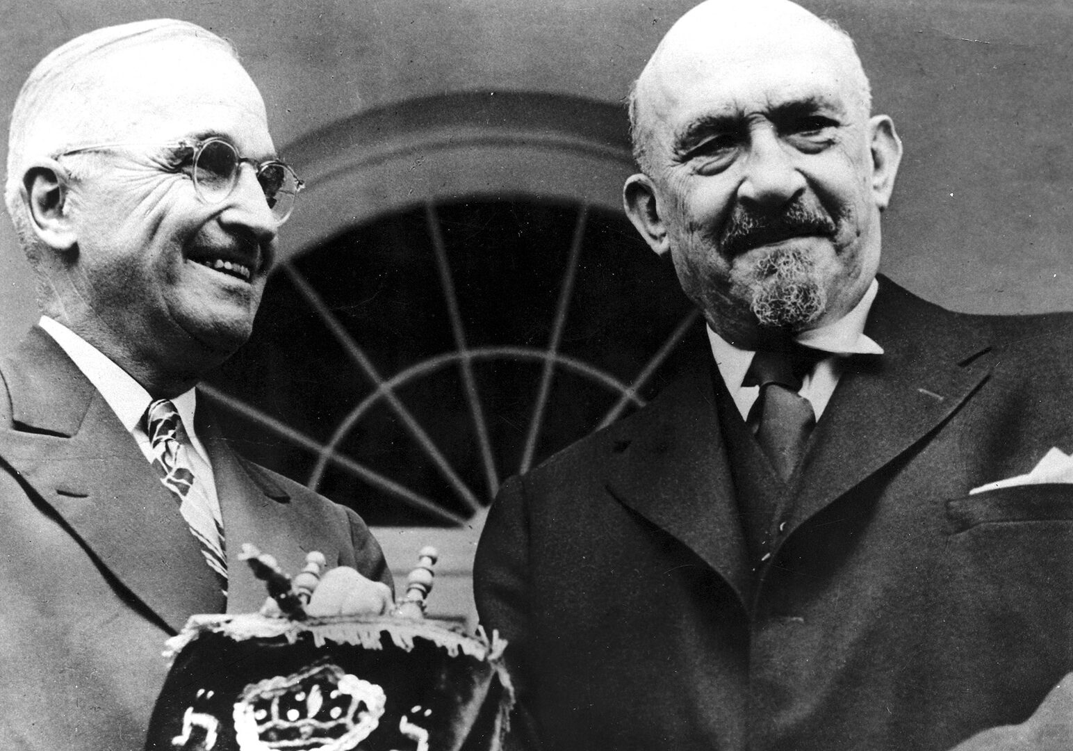 Israeli President Chaim Weizmann with President Truman with the torah at the White House