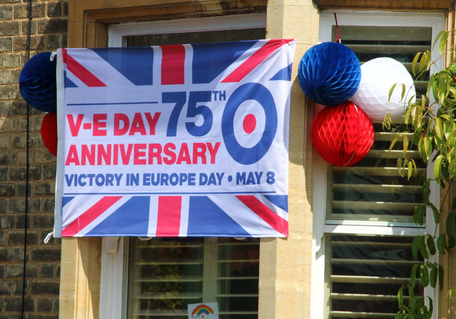 House decorated with a VE Day banner during the commemoration. The VE Day 75th anniversary, when Victory in Europe over the Germans was announced during World War Two, being commemorated during lockdown restrictions of the coronavirus COVID-19 pandemic. (Keith Mayhew | SOPA Images| Sipa US)| (Sipa via AP Images)