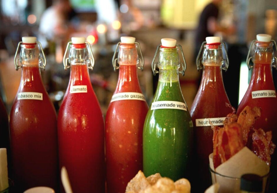 A shot of bottles holding Bloody Mary ingredients.